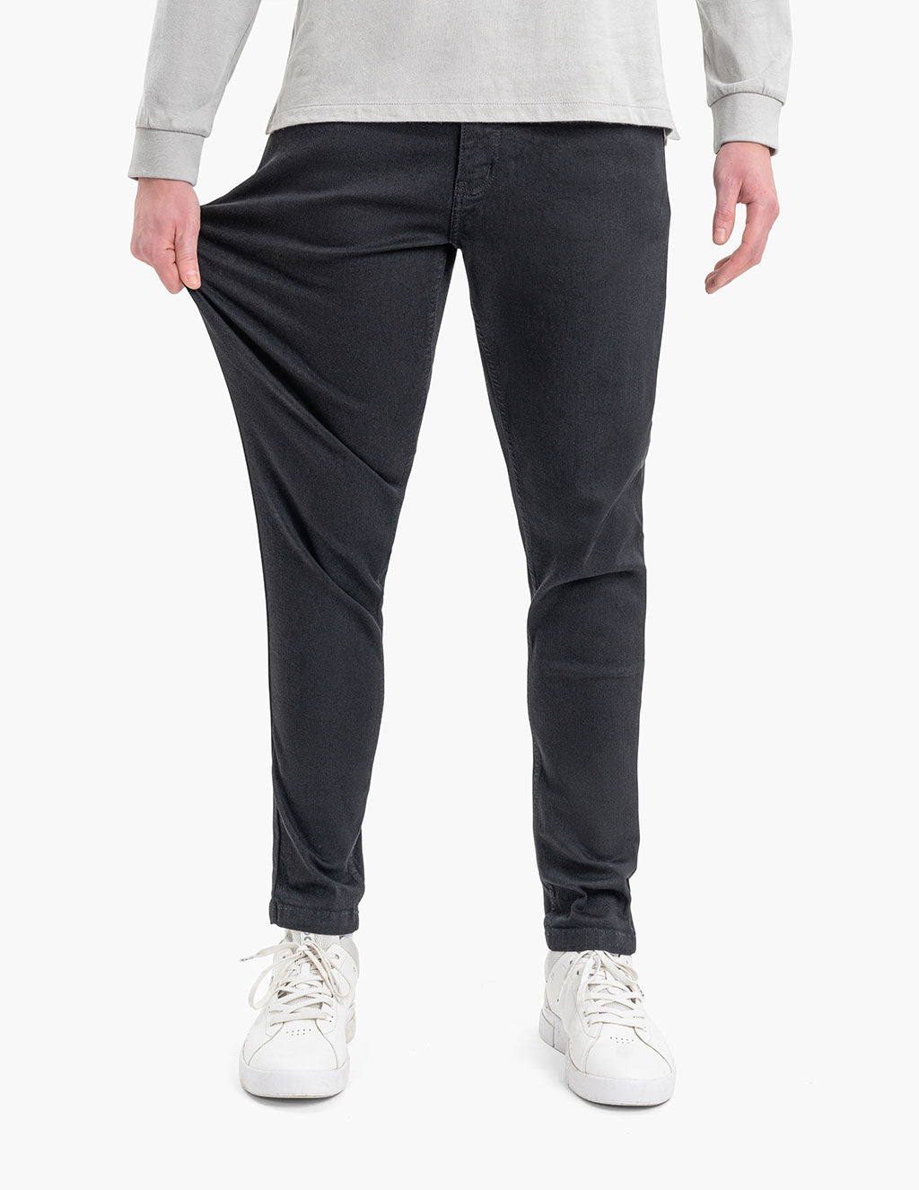 Model wearing Squid Inks Tapered jeans, showcasing flexibility and fit.