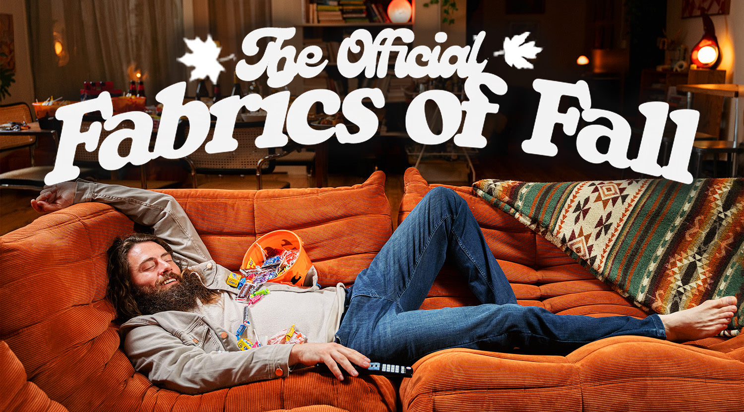 Man lying on orange couch with candy and remote, text reads 'The Official Fabrics of Fall'