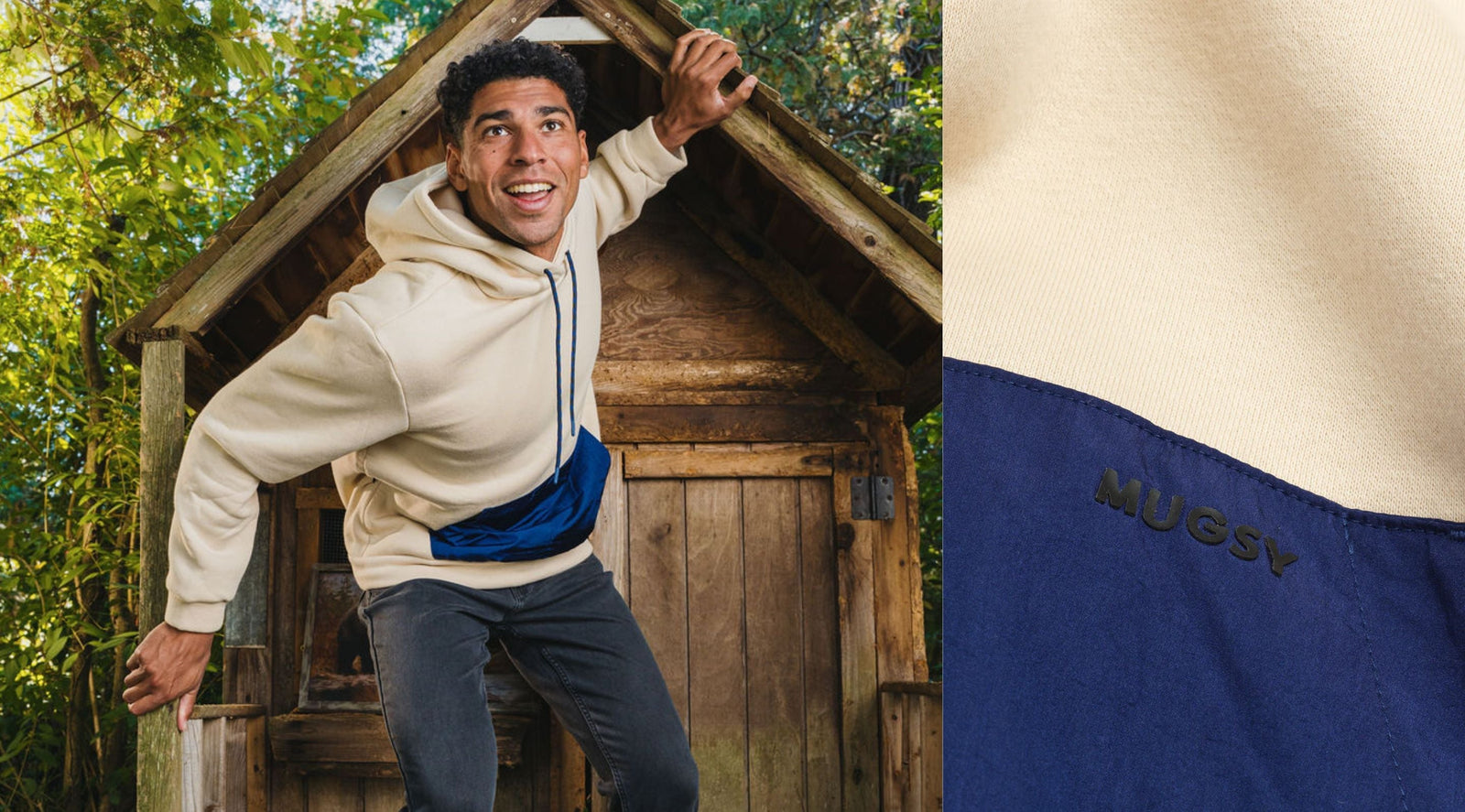 Man leaning out of a small wooden playhouse wearing a beige mixed-media hoodie with a bright blue pouch pocket stamped MUGSY