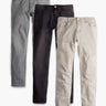 Flat lay of Weekend Jeans 3-pack showing three classic-fit jeans in gray, black, and khaki on a white background