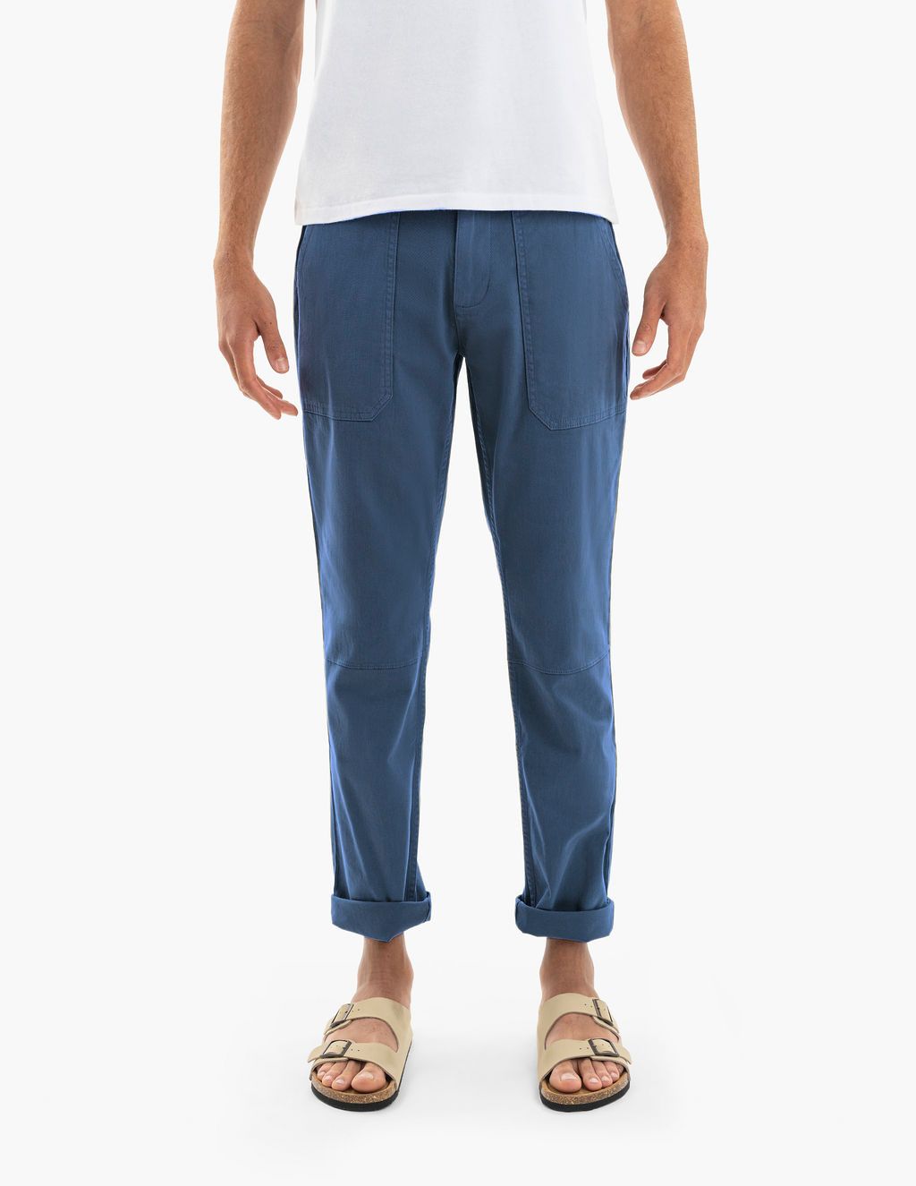 Front view of Atlantics twill drawstring pants on model showing relaxed fit, front patch pockets and rolled cuffs on white background