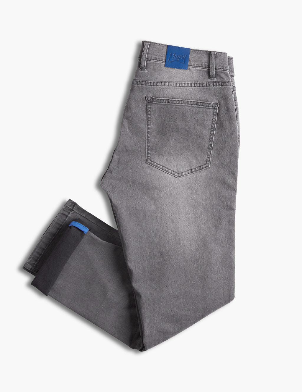 Folded gray denim jeans with back pocket, blue brand patch at waistband and small blue cuff tab.