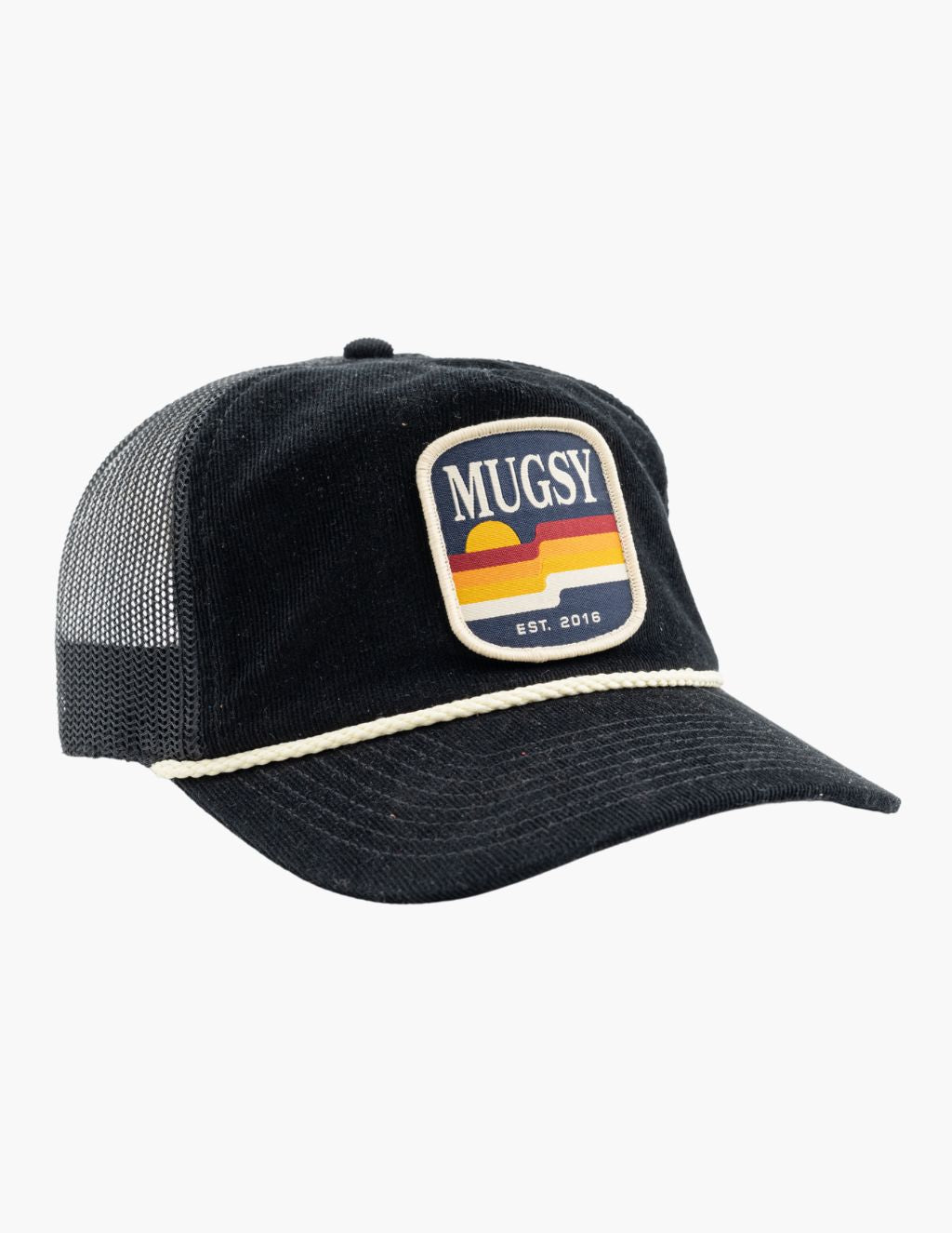Black corduroy trucker cap with mesh back, braided rope above brim and front patch reading 'MUGSY' and 'EST. 2016'.