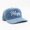 Blue corduroy baseball cap with white embroidered 'Mugsy' script on front.