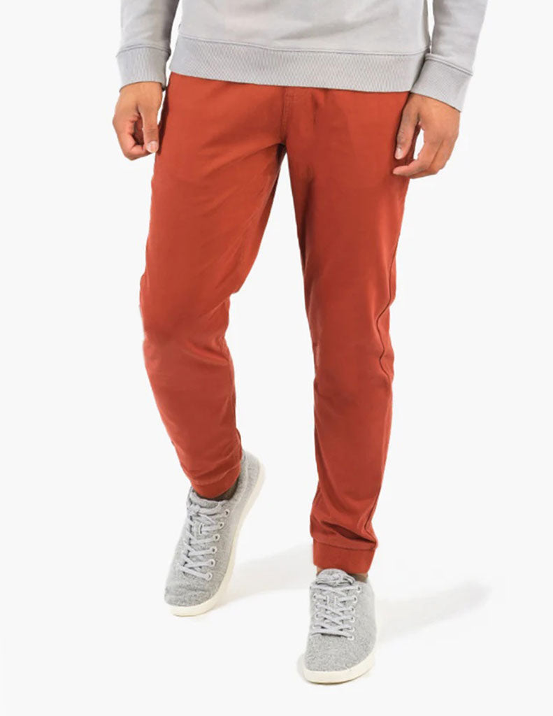 Model wearing Bradleys joggers in washed red color