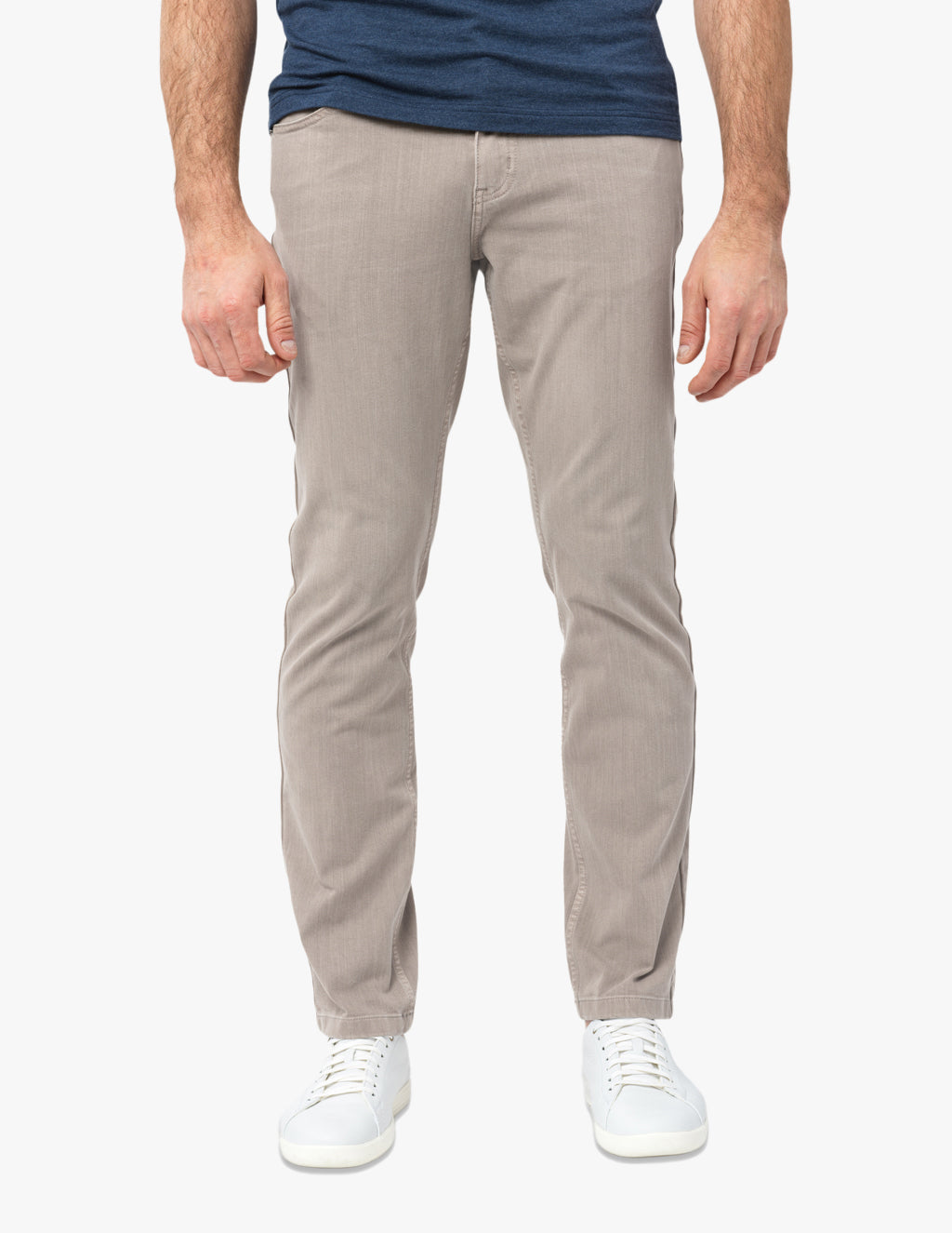 Model wearing Bucks Coolmax pants in light color with white sneakers