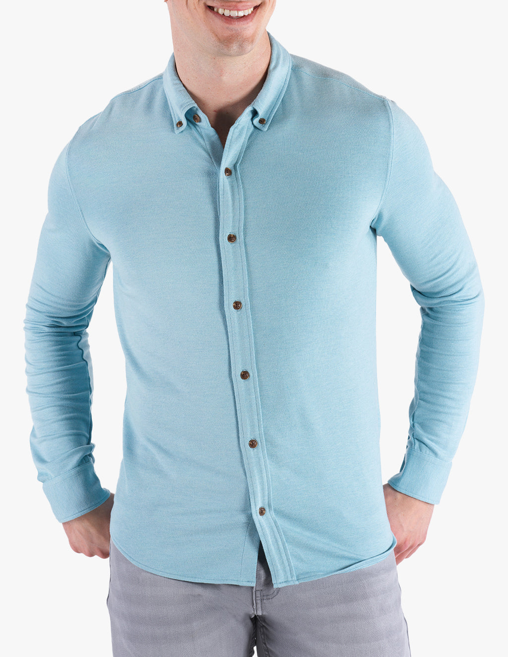 Model wearing a light blue button-down shirt, Stratos