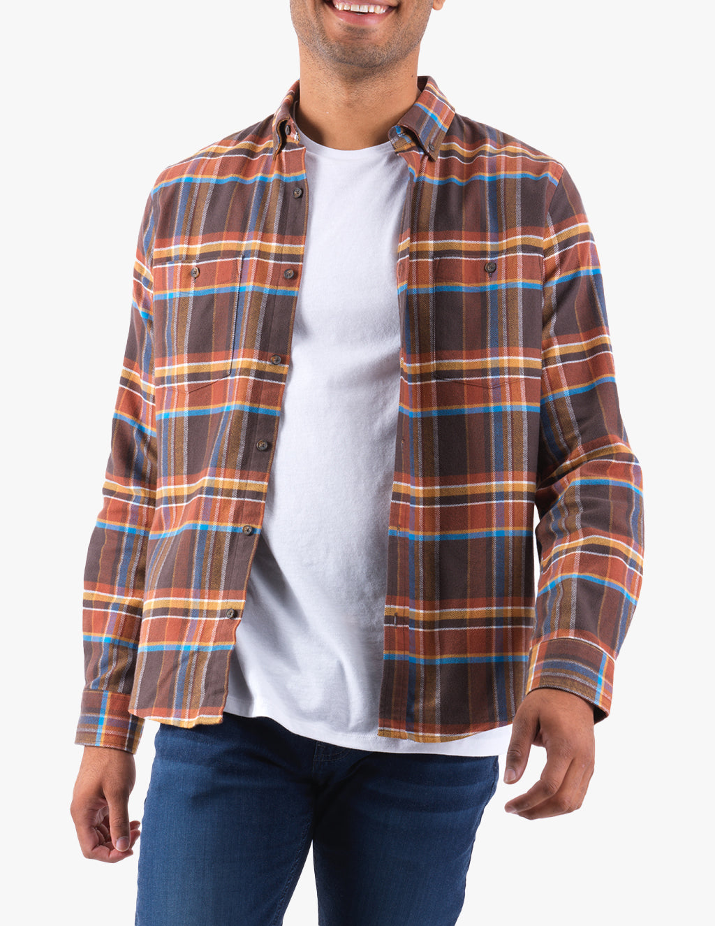 Model wearing a plaid Davies shirt in brown, blue, and rust colors.