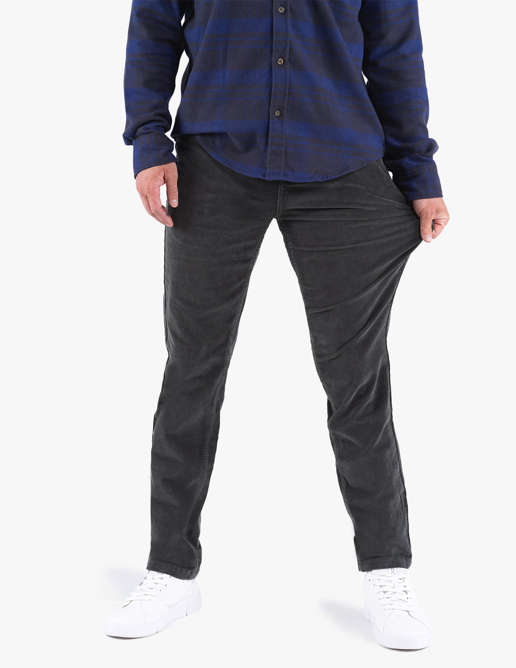 Model wearing Dunes corduroy pants, showcasing flexibility and fit.