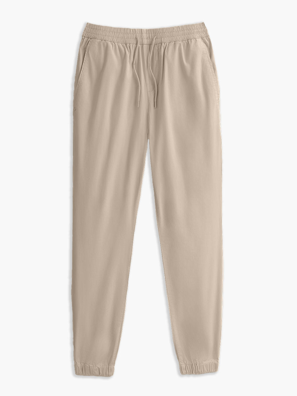 Beige jogger pants with elastic waistband, drawstring, side pockets, and elastic cuffs.