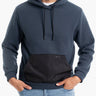 Model wearing a navy Frostbites hoodie with a black pocket.