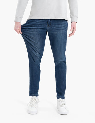 Model wearing Fultons Tapered jeans in classic blue, showcasing fit and style.