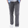 Model wearing Gravels canvas utility pants in gray, standing with hands in pockets.