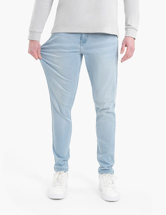 Model wearing Grands Tapered lightwash jeans, showcasing fit and style.