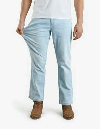 Front view of Grands Bootcut jeans in light wash on model showing bootcut leg and stretch against white background