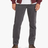 Model wearing gray straight-leg jeans and brown leather lace-up boots, cropped at mid-waist.