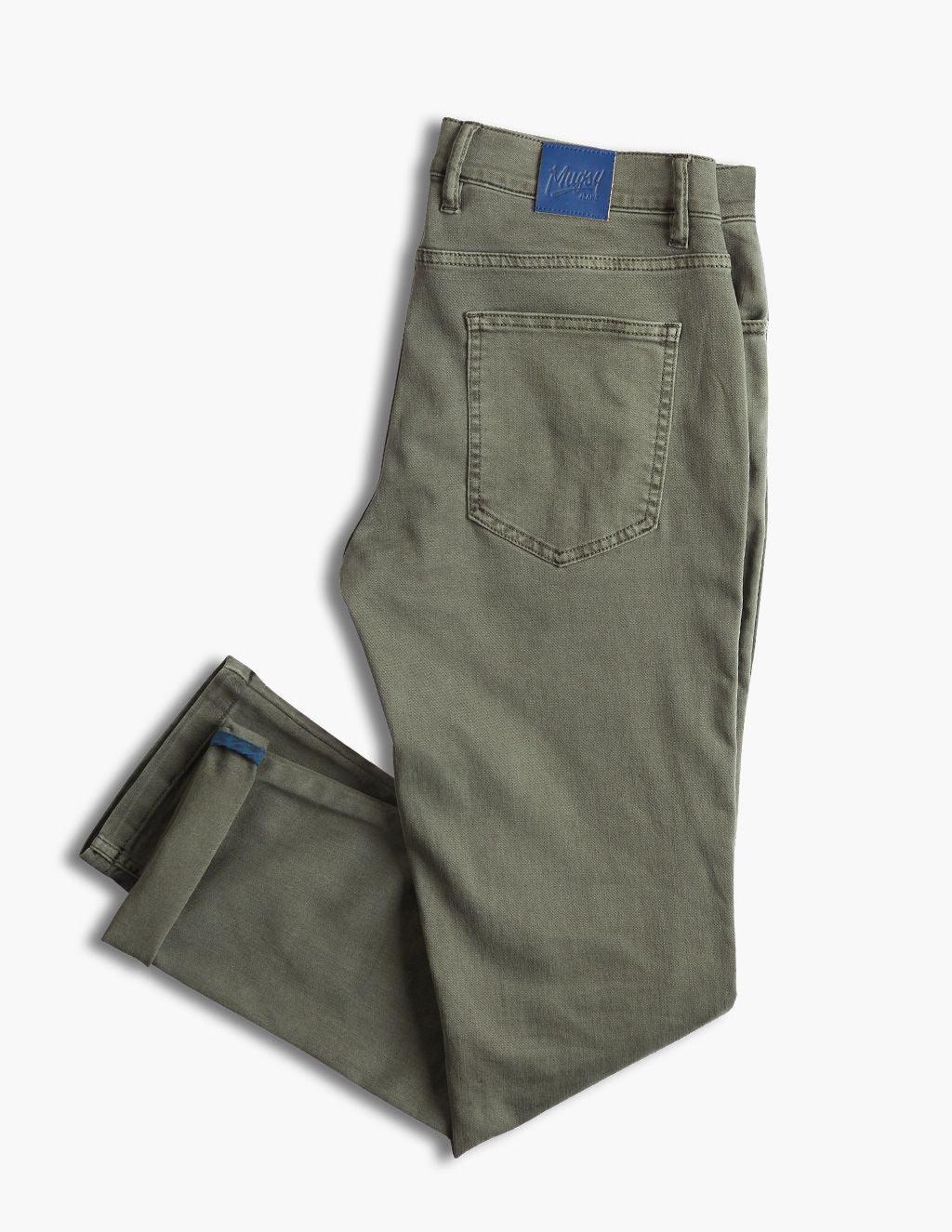 Olive-green folded jeans with back pocket and blue brand patch at waistband