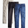 Flat lay of Versatile Jeans 3-pack showing front view of medium blue, dark gray, and khaki jeans on white background