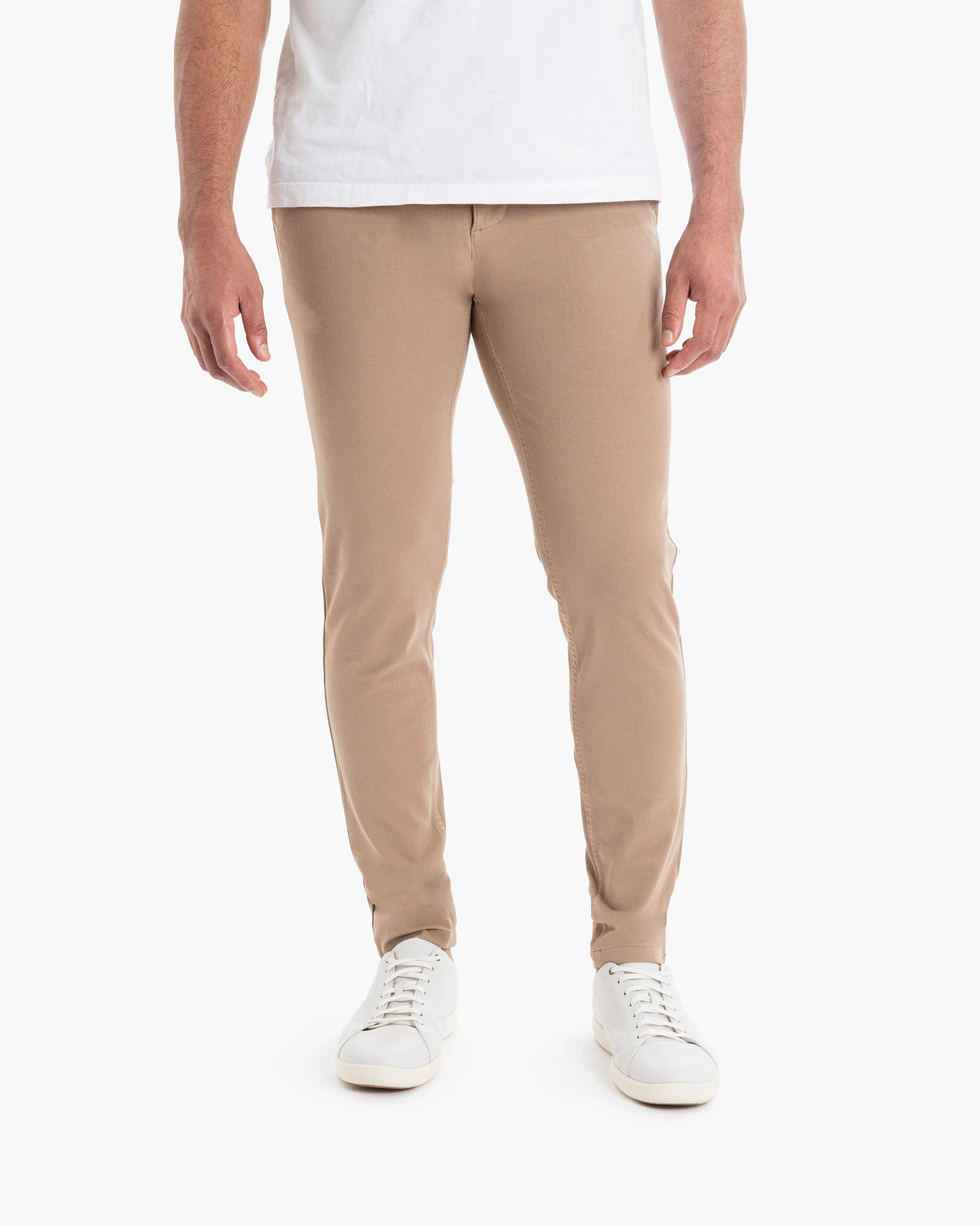 Front view of Belmonts Tapered chinos showing slim tapered fit in camel on model against white background