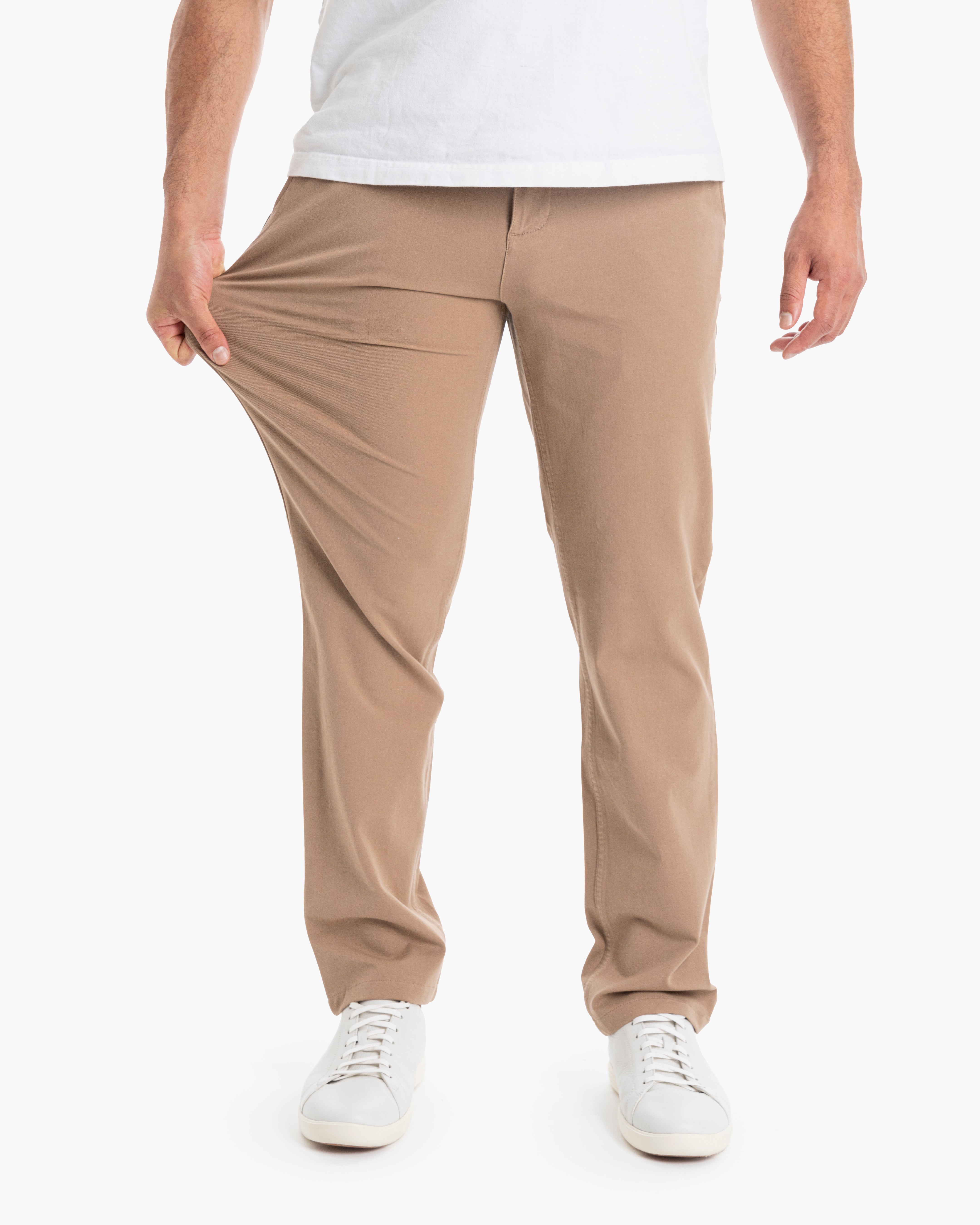 A person wearing Belmonts Casual pants, showcasing their stretchability.