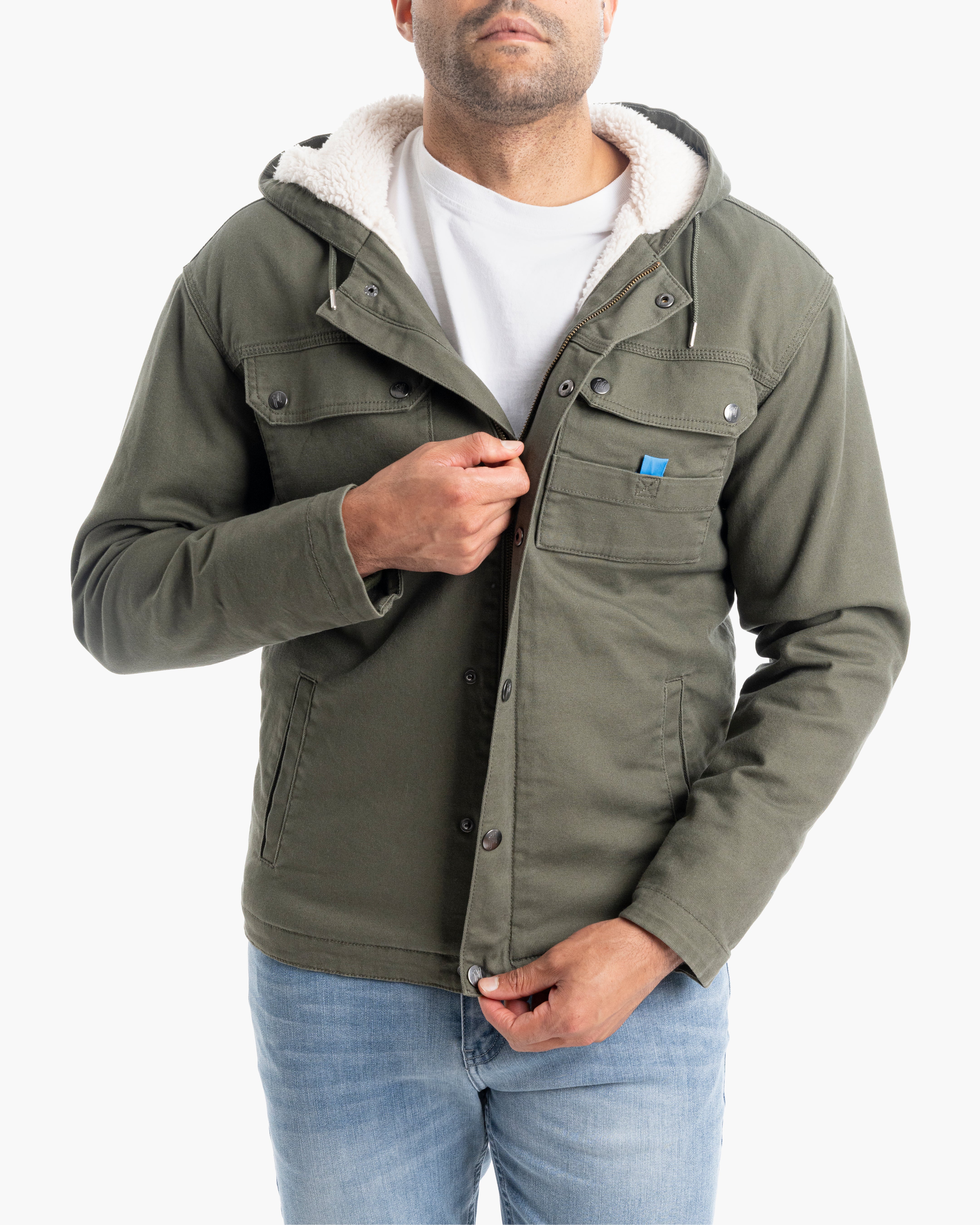 Model wearing a green Sherpa-lined utility jacket with a hood, unzipped to show interior lining.