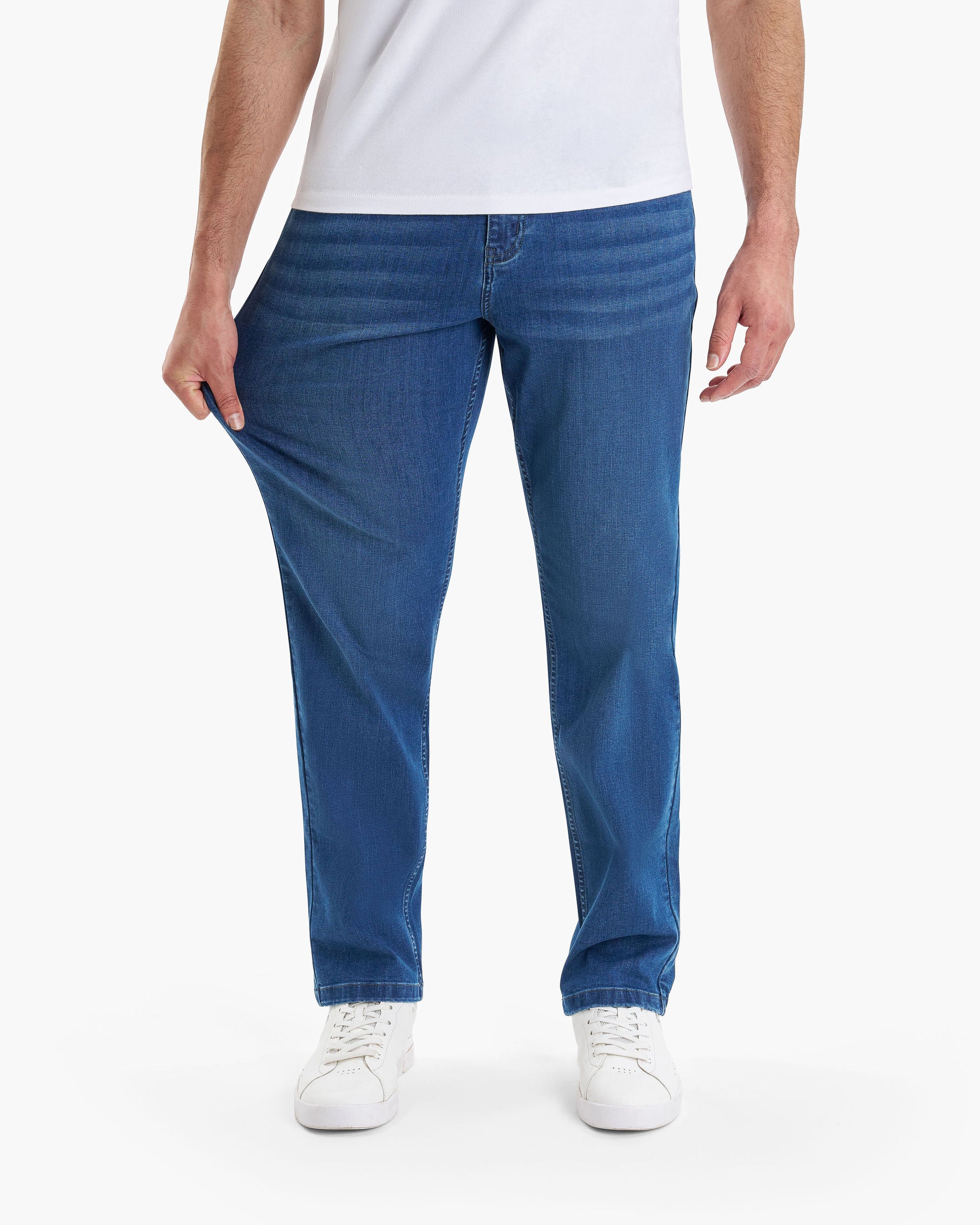 Model wearing Lake Shores Casual jeans in medium blue.