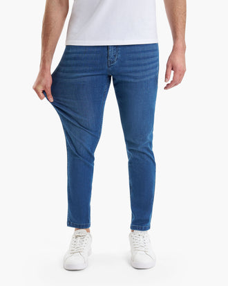 Lake Shores Tapered blue jeans, slim tapered fit, model wearing white shoes