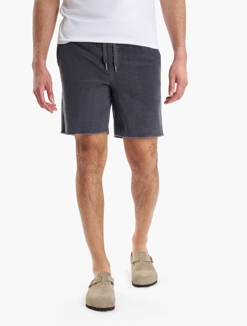 Model wearing Dunes shorts in dark color