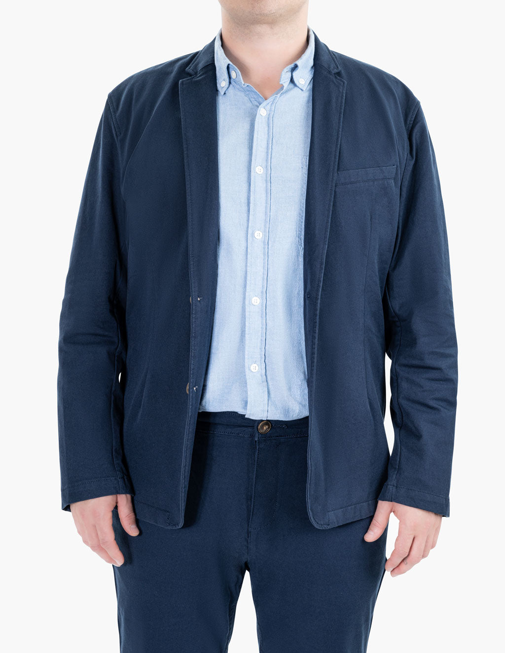 Model wearing a navy Morgans blazer over a light blue shirt