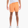 Front view of Daybreaks men's swim trunks in peach orange with elastic drawstring waist and mid thigh fit on white background