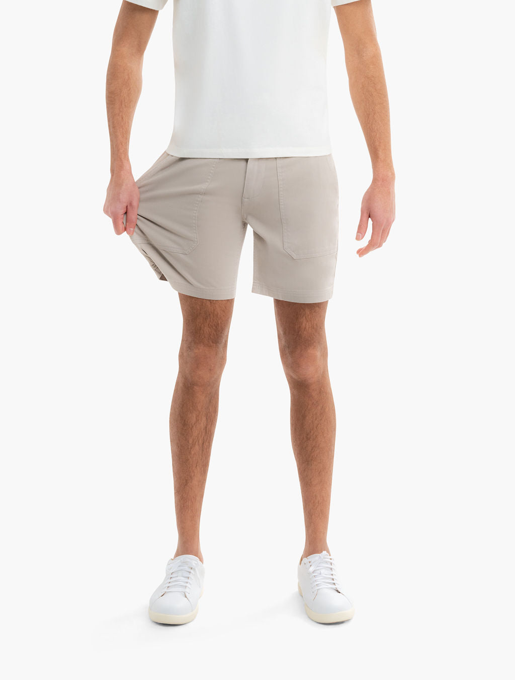Front view of Beachwoods drawstring twill shorts in khaki on model; 7 in inseam, patch pockets, drawstring waist