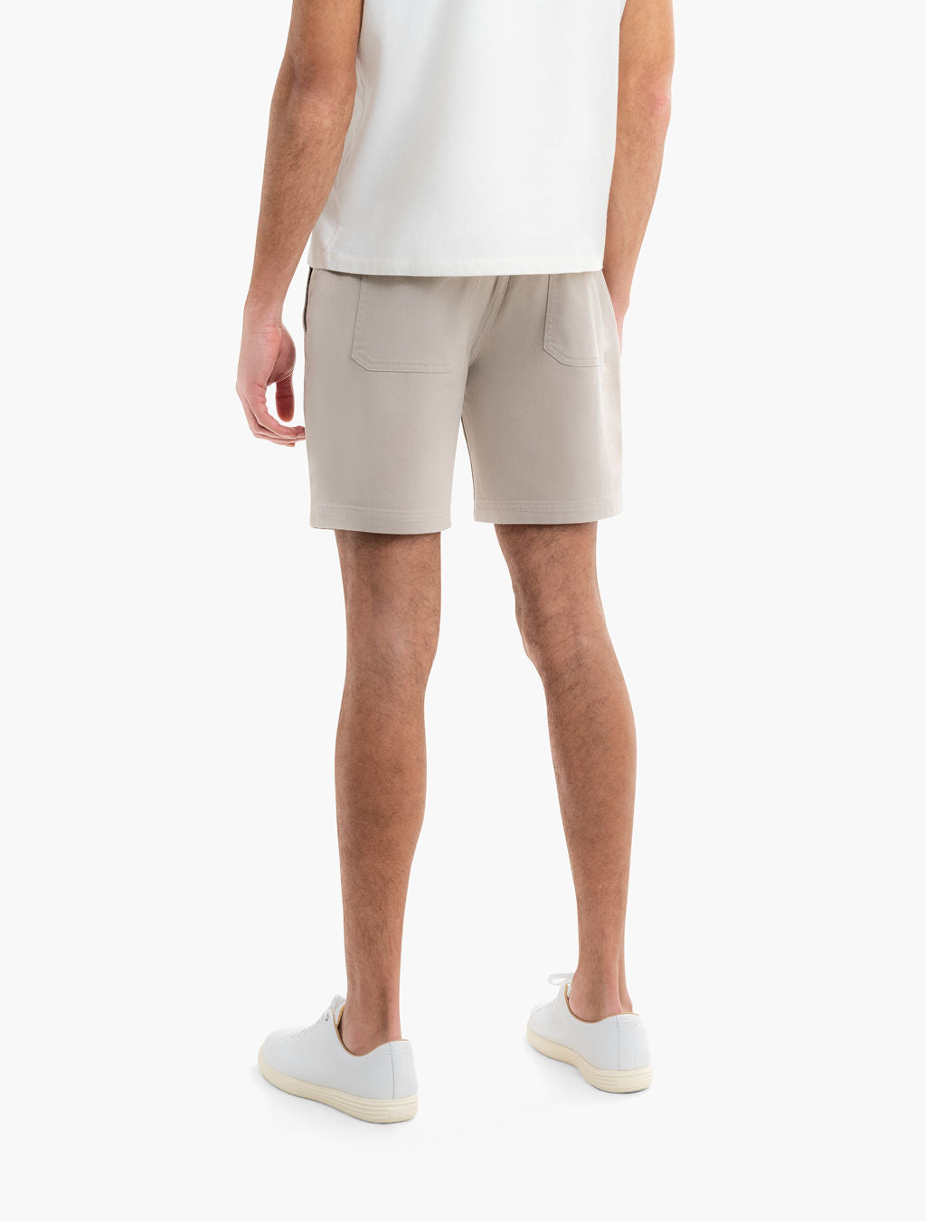 Rear view of Beachwoods drawstring shorts in khaki showing oversized patch back pockets and 7 in inseam on white background
