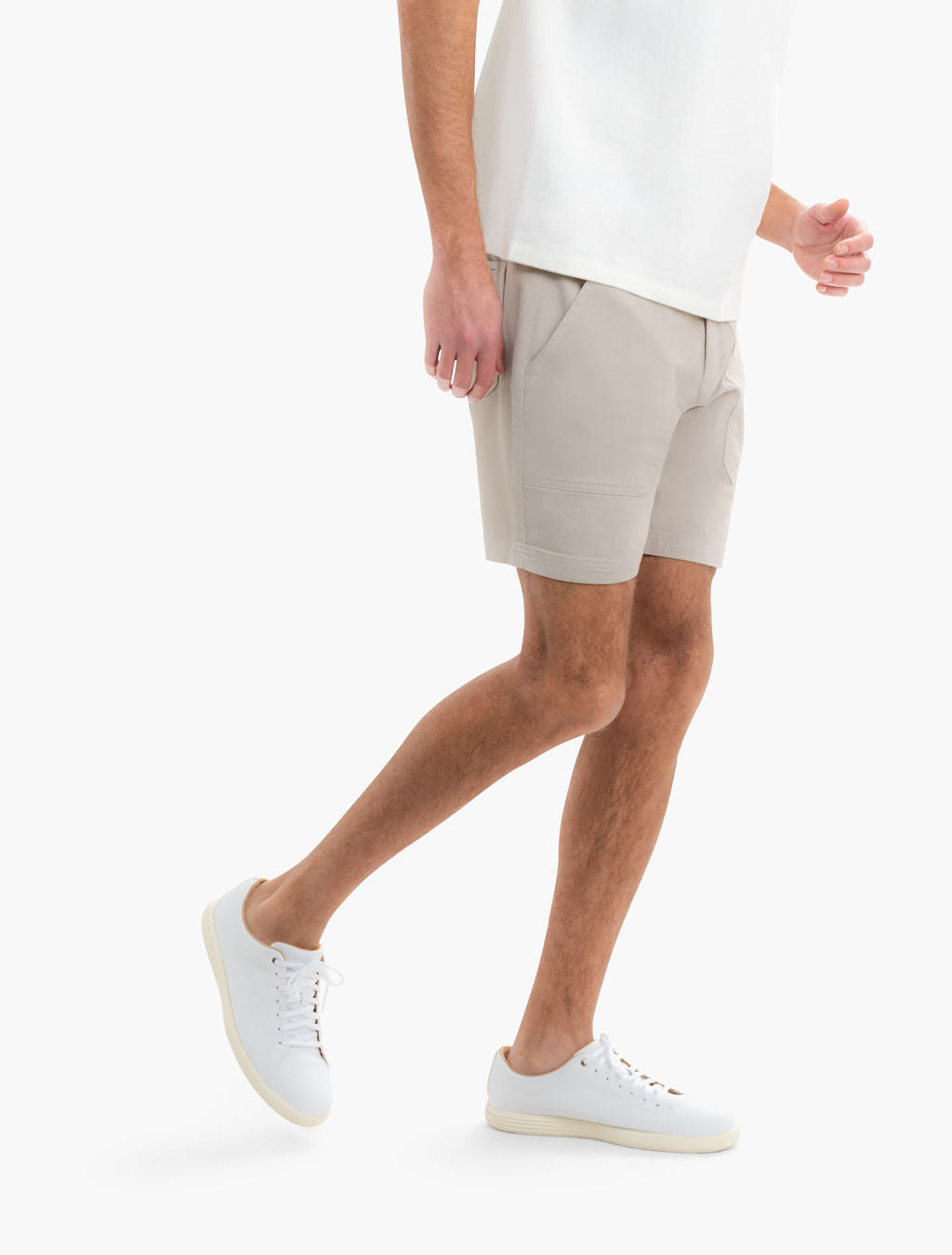 Side view of Beachwoods khaki drawstring patch pocket shorts on model showing 7 inch inseam on white background