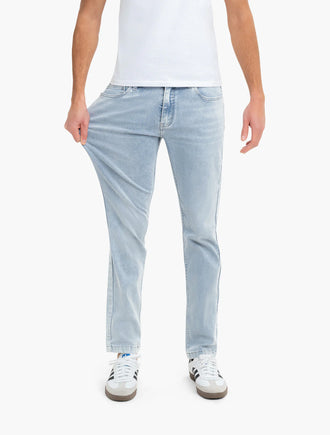 Front view of Sawyers jeans on model showing light vintage wash, classic fit, and stretch on white background