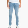 Front view of Daytonas Tapered jeans in vintage washed light blue showing slim tapered fit, ankle-length hem, and stretch denim on white background