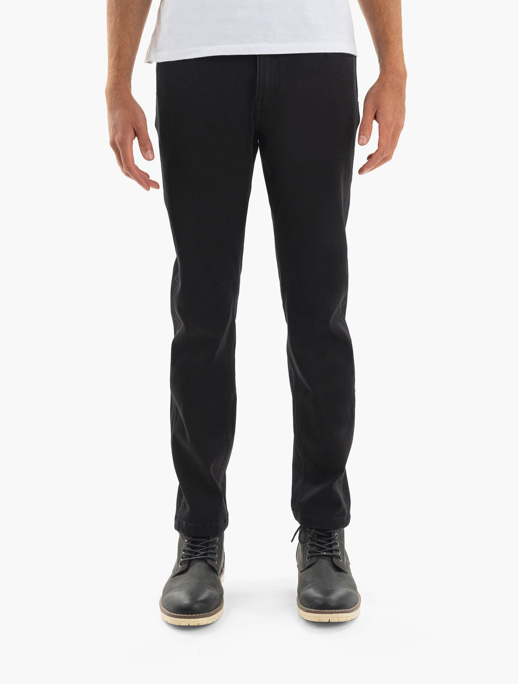 Front view of male model wearing slim black pants and black lace-up boots, shown from waist to feet.