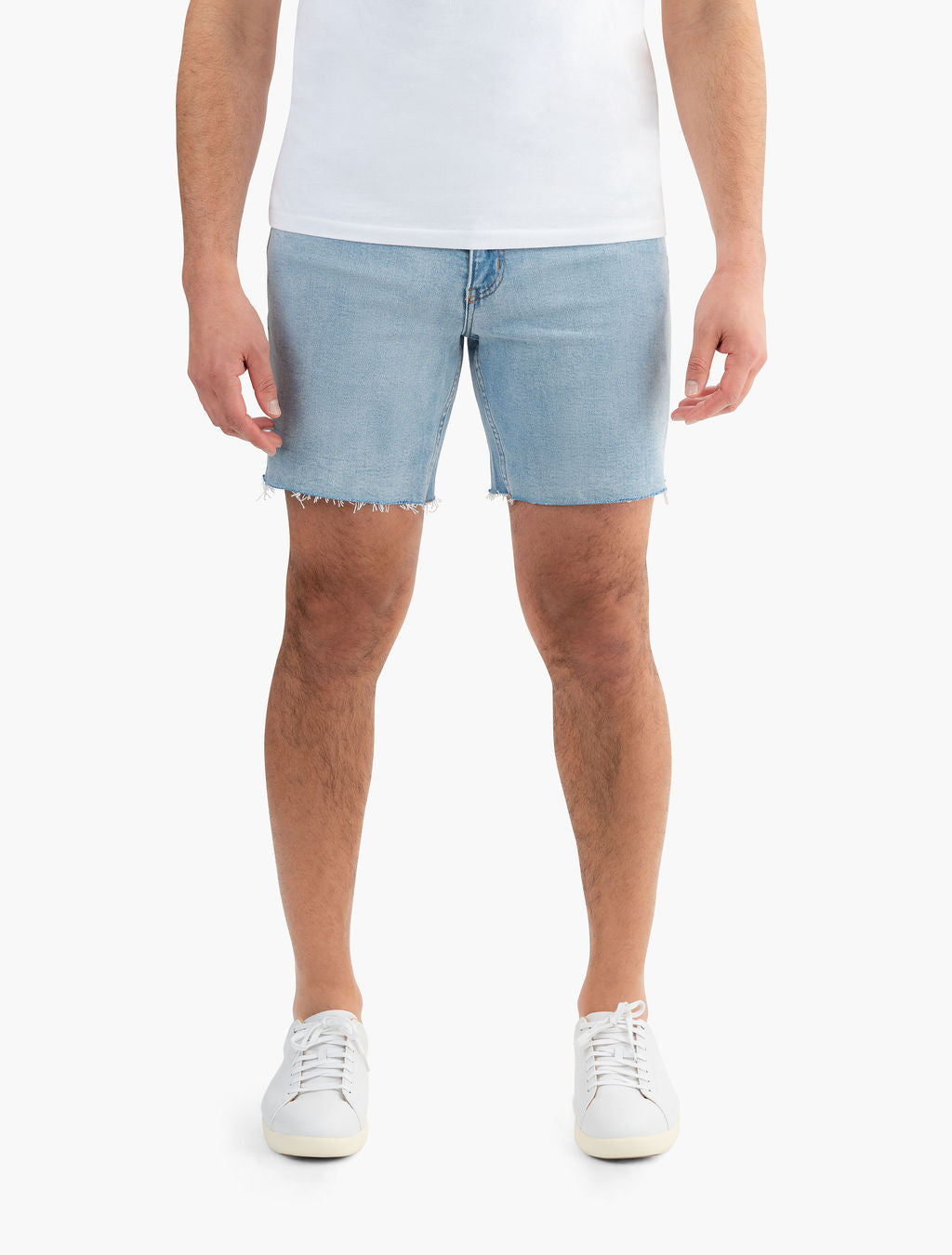 Model wearing vintage blue stretch jorts, showcasing fit and style