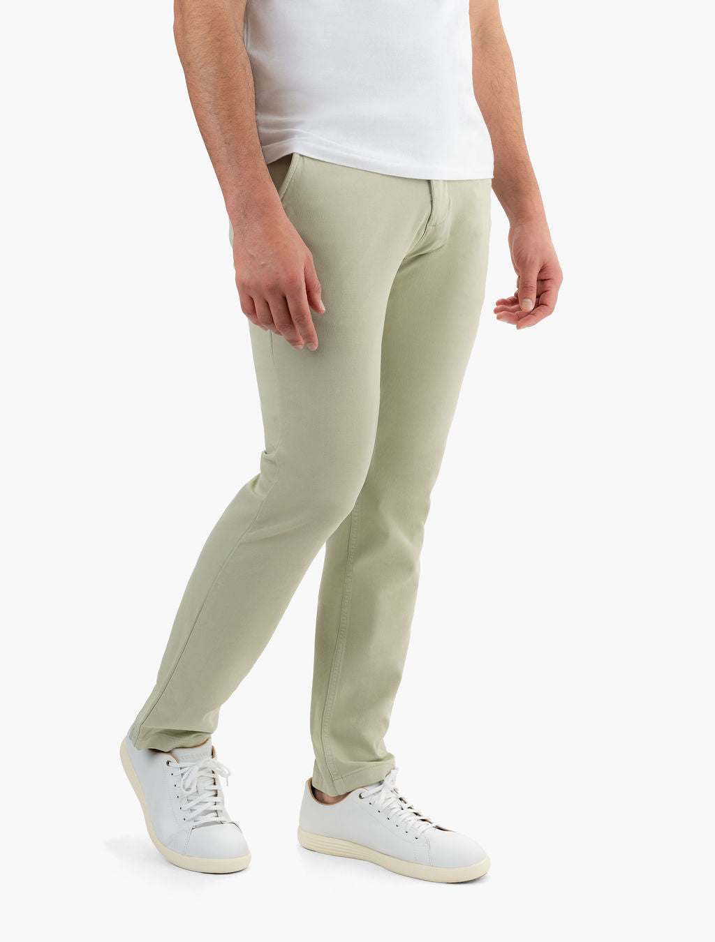Three-quarter front of Willows chinos in sage green showing slim classic fit and soft stretch fabric on white background