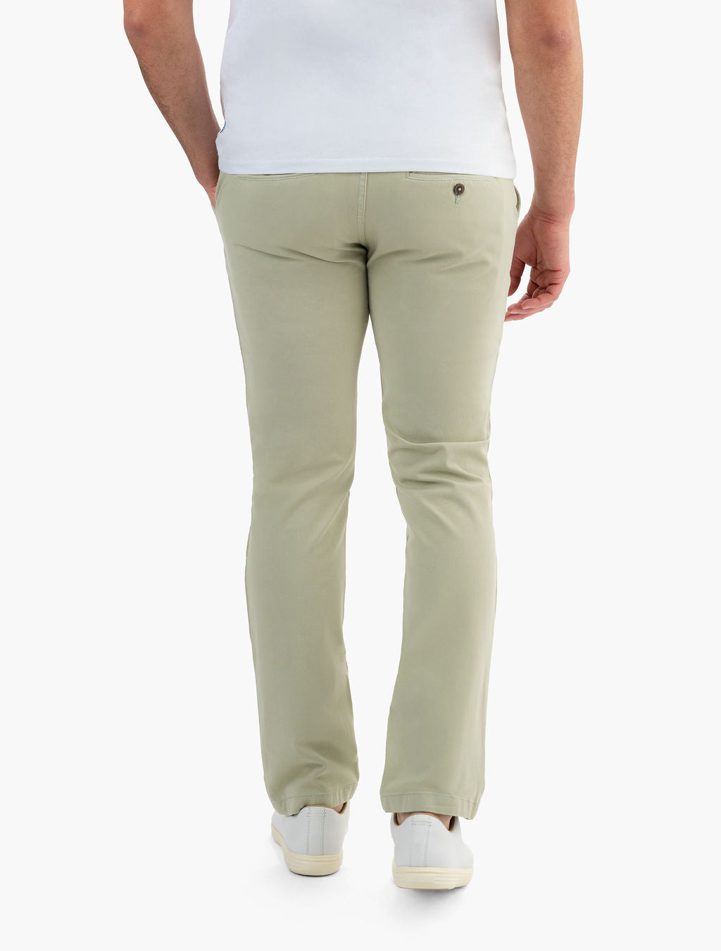 Rear view of Willows chinos in sage green on model showing back welt pocket with button and straight fit