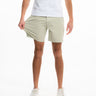 Front view of Willows chino shorts in light sage on model showing stretch fabric and mid-thigh length on white background