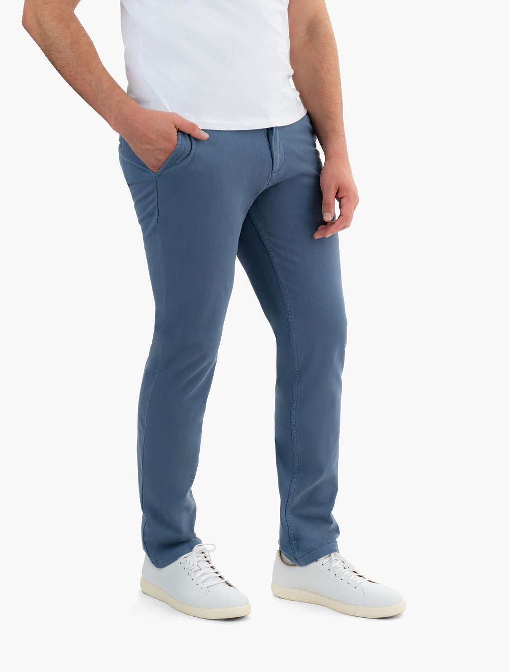 Front three-quarter view of Saltwaters sea blue chinos showcasing classic fit and stretch fabric against white background