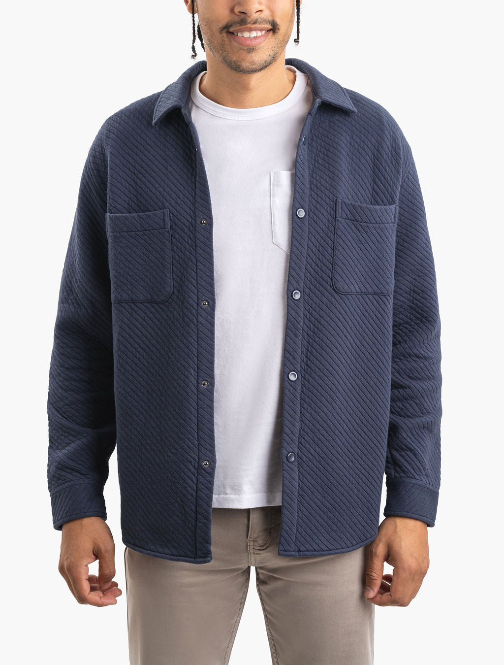 Model wearing a navy Mariners quilted shacket, front view.