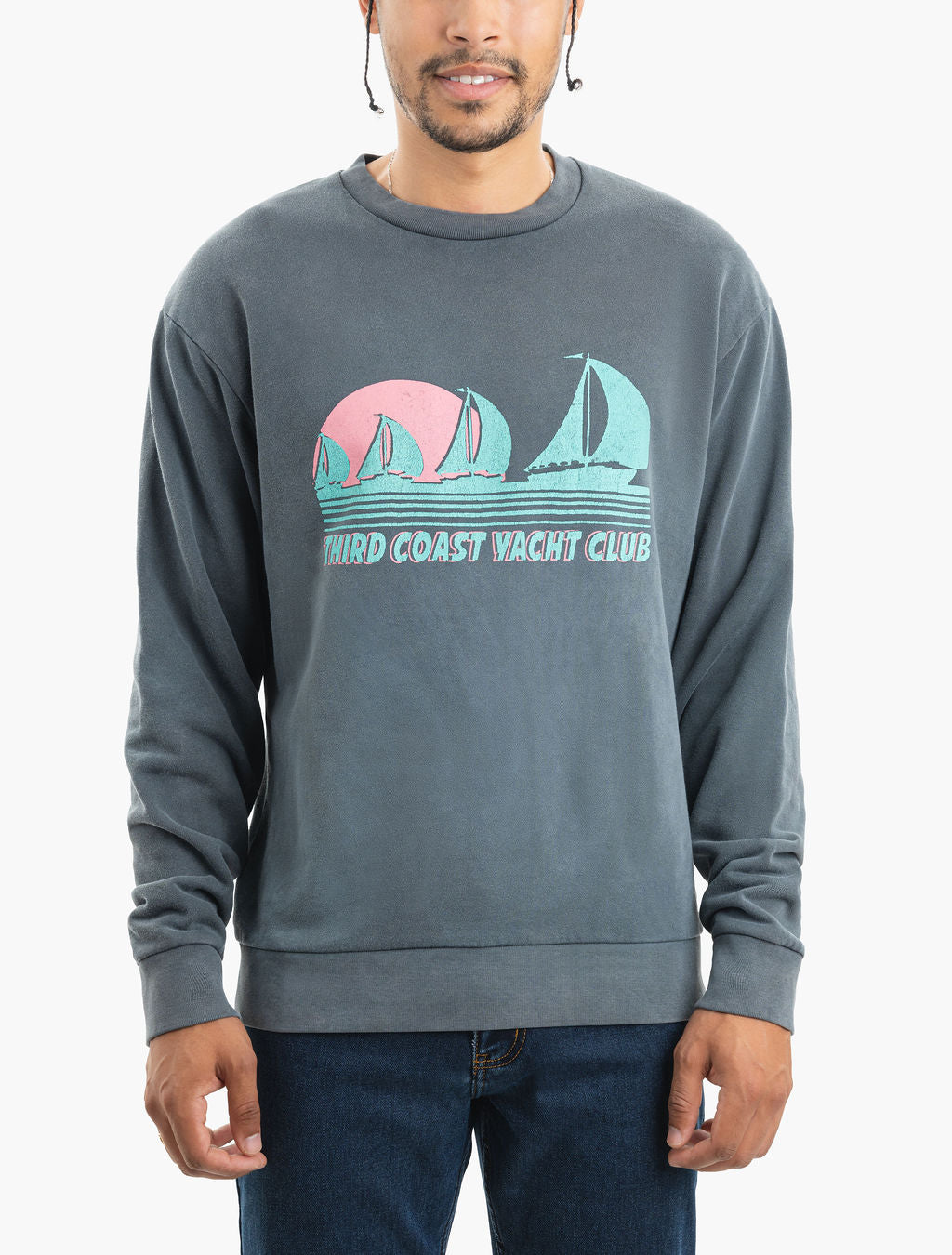 Model wearing faded gray sweatshirt with retro sailboat graphic and text 'THIRD COAST YACHT CLUB'.
