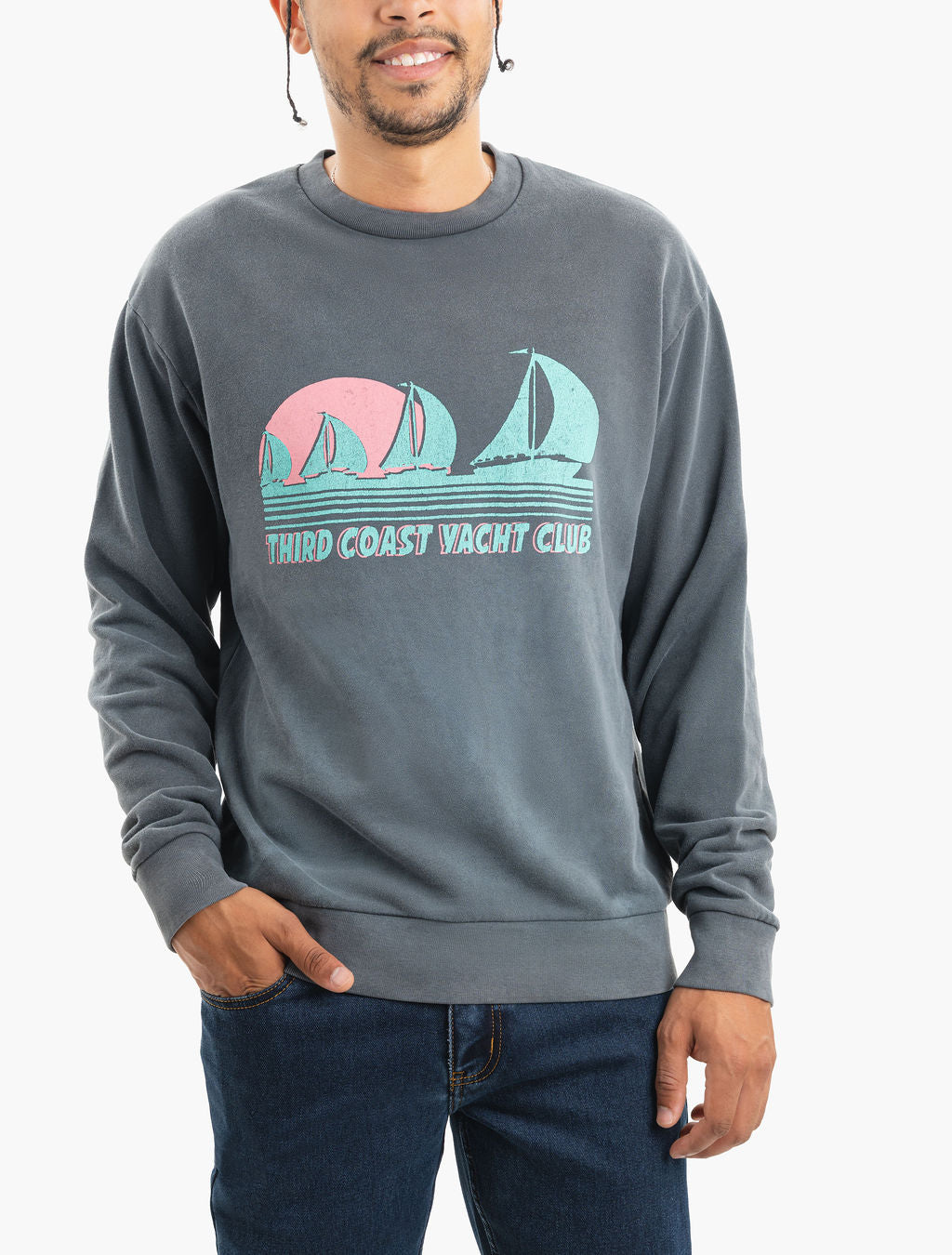Man wearing faded gray sweatshirt with turquoise and pink sailboat graphic and text 'THIRD COAST YACHT CLUB'.