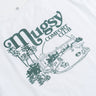 Back of white tee printed 'Mugsy' above 'COMFORT CLUB' and green poolside line-art with palm trees and motorcycles