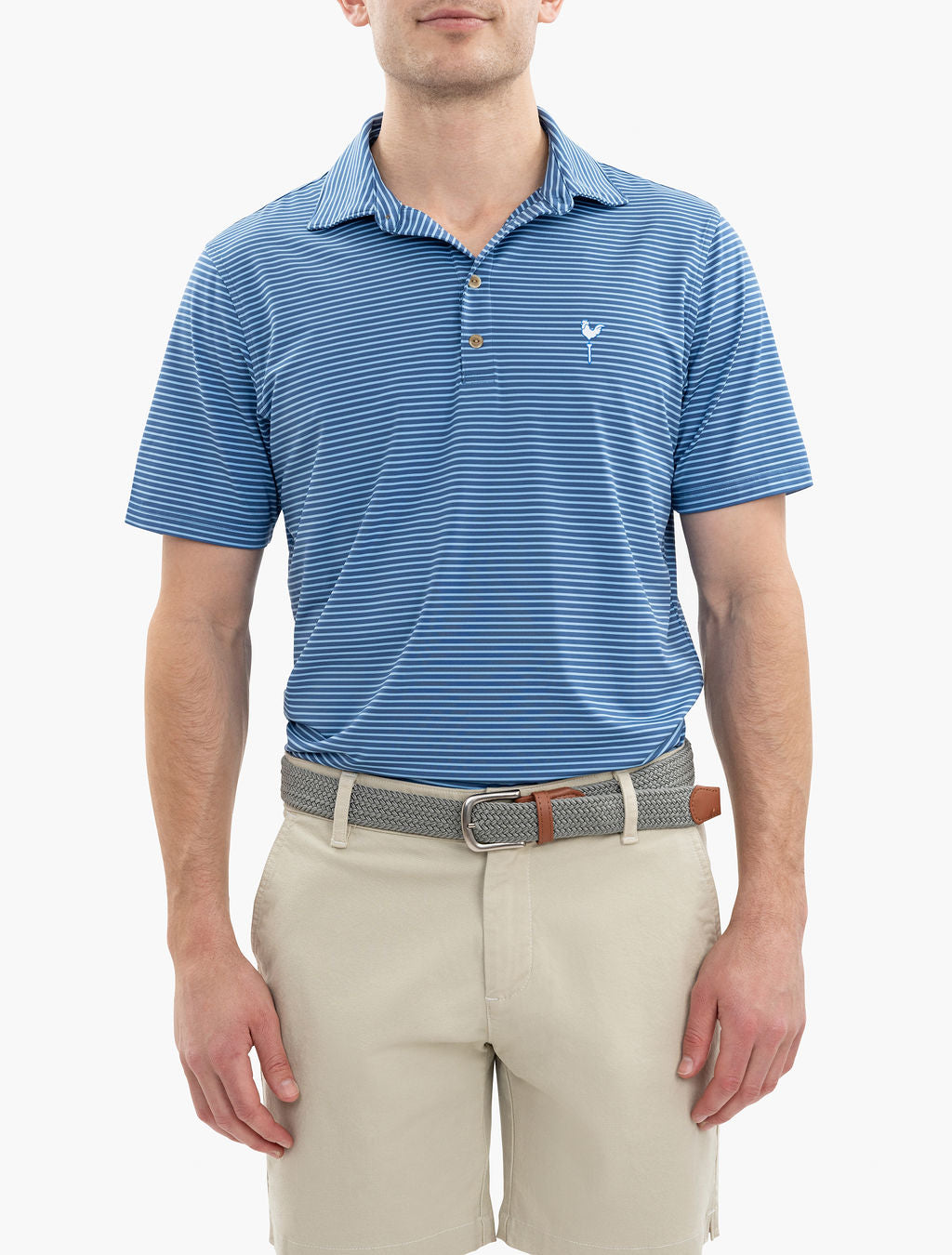 Man wearing a blue polo shirt and beige pants