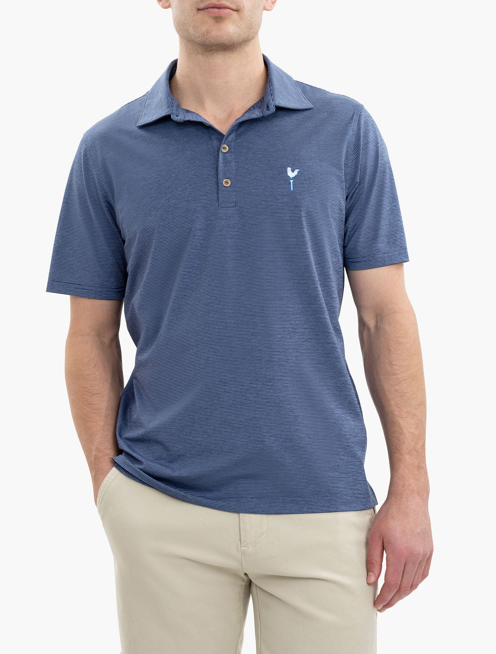 Man wearing a blue striped polo shirt with a small white rooster logo on the chest, paired with beige pants.