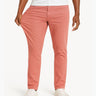 Coral straight-leg stretch pants on model, fabric pulled to show stretch