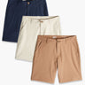 Flat lay of three Chino Shorts (navy, cream, tan) showcasing front waist, button, and side pockets on a white background