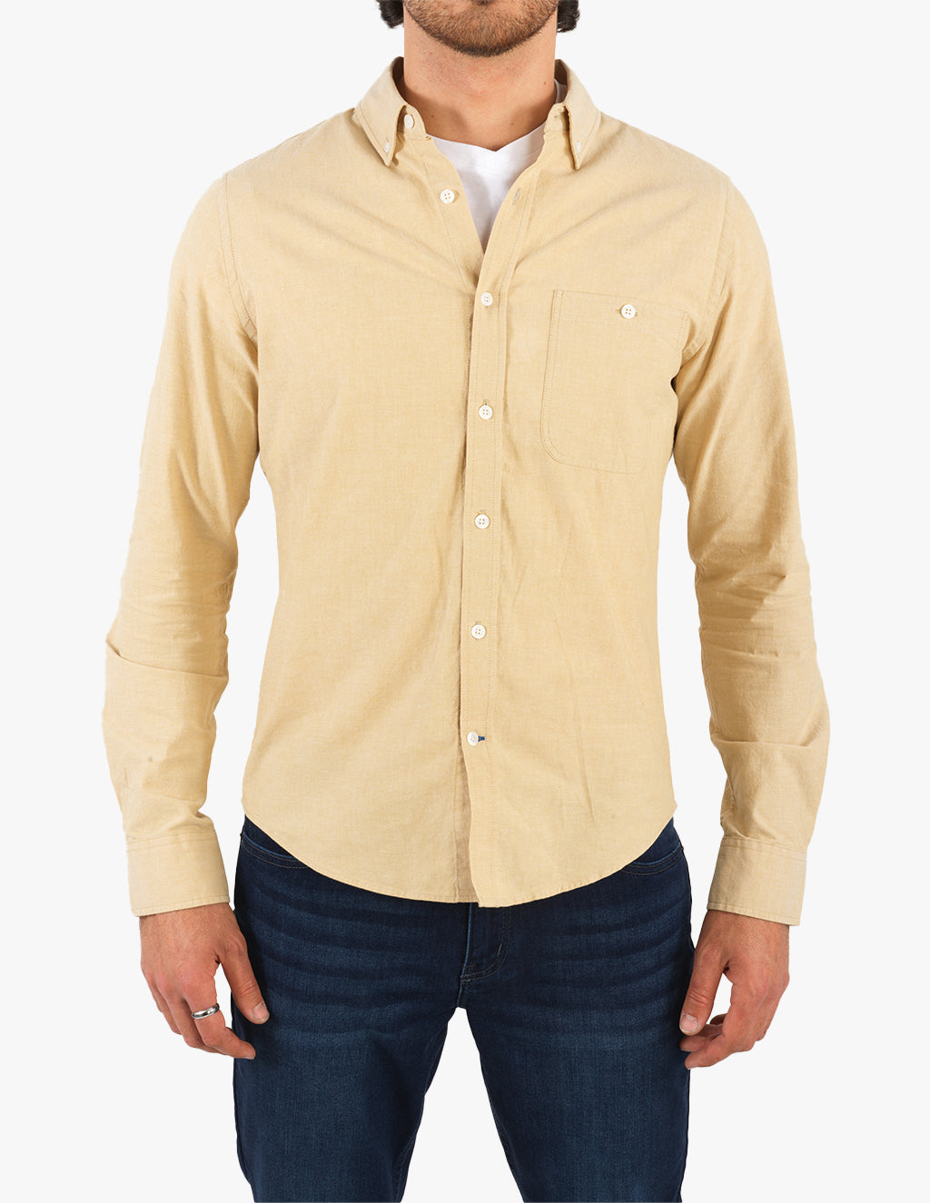 Tan chambray button-down shirt worn by a model